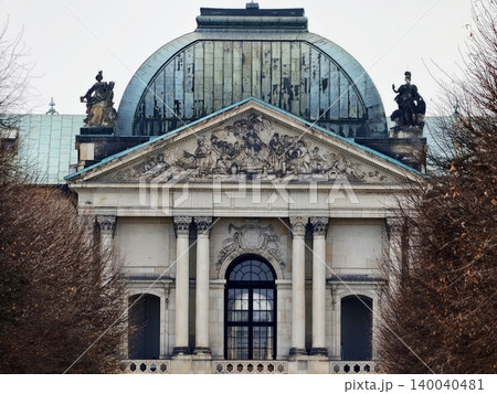 Decorative historic architecture. Ancient ornate facade featuring weathered stone reliefs and domes Decorative historic architecture. Ancient ornate facade featuring weathered stone reliefs and domes 140040481