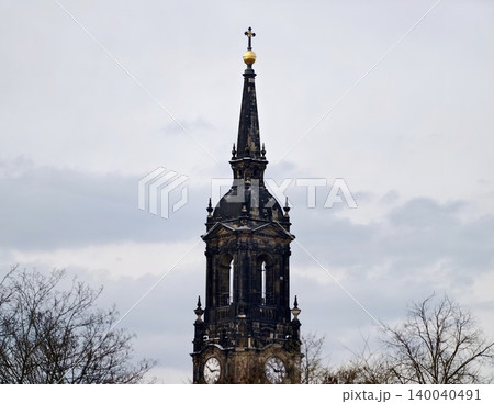Lofty slender spire piercing through thick cloudy atmosphere creating striking visual contrast Lofty slender spire piercing through thick cloudy atmosphere creating striking visual contrast 140040491