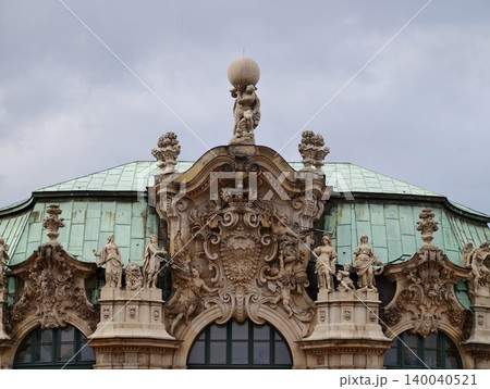 Decorative historic building. Elaborate baroque design with sculpted figures and verdigris patina Decorative historic building. Elaborate baroque design with sculpted figures and verdigris patina 140040521