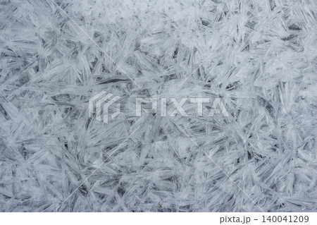 Intricate frozen river surface with jagged, crystalline ice shards creating a unique, abstract texture Cold weather pattern, natural winter beauty Intricate frozen river surface with jagged, crystalline ice shards creating a unique, abstract texture Cold weather pattern, natural winter beauty 140041209