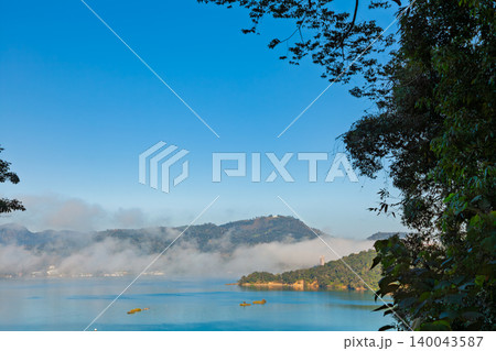 Mist over Sun Moon Lake shoreline in Taiwan Mist over Sun Moon Lake shoreline in Taiwan 140043587