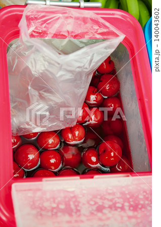 Pickled red plums at Taiwan street market 140043602