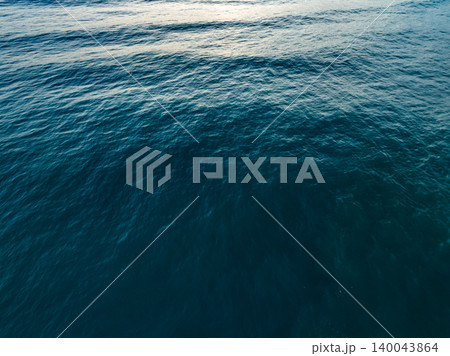 Sea surface aerial view,Bird eye view photo of blue waves and water surface texture Blue sea background Beautiful nature Amazing view sea background Sea surface aerial view,Bird eye view photo of blue waves and water surface texture Blue sea background Beautiful nature Amazing view sea background 140043864
