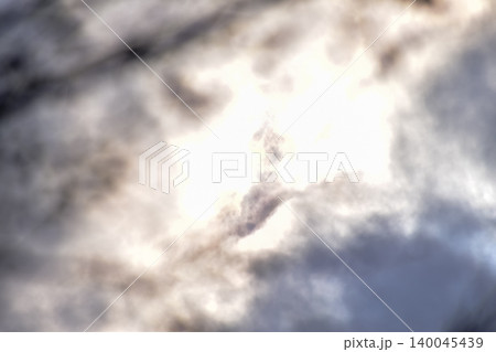 Cloudscape with clouds covering the sun under the blue sky. Nature scene, skyscape and cloudscape. Cloudscape with clouds covering the sun under the blue sky. Nature scene, skyscape and cloudscape. 140045439