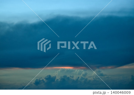 Dramatic colorful cloudscape with the sunbeam at the sunset. Sunlight through the clouds. Sunset skyscape, sunset background. Nature concept Dramatic colorful cloudscape with the sunbeam at the sunset. Sunlight through the clouds. Sunset skyscape, sunset background. Nature concept 140046009