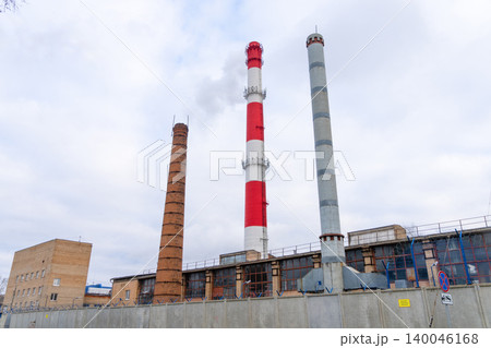 Industrial skyline scene. An industrial horizon with distinct chimney types and structural layers Industrial skyline scene. An industrial horizon with distinct chimney types and structural layers 140046168