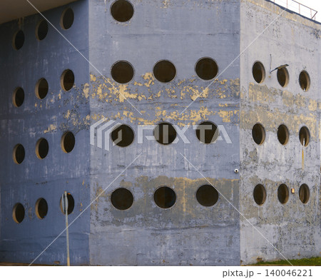 Architectural background demonstrating brutalist geometric design with weathered paint and moss accents Architectural background demonstrating brutalist geometric design with weathered paint and moss accents 140046221