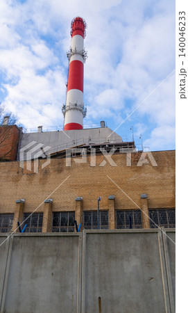 Concrete barriers with chimneys and rooftops highlighting safety and industrial protection elements 140046233