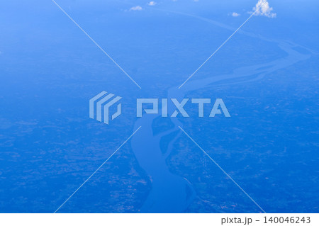 High angle view of the skyscape and cityscape. The view of Japan from the airplane window. Flying over Japan, Asia. Travel and nature scene. 140046243