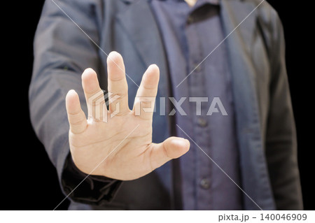 Man showing stop gesture with open palm. Business Authority Concept. Human Body Language. High quality photo Man showing stop gesture with open palm. Business Authority Concept. Human Body Language. High quality photo 140046909