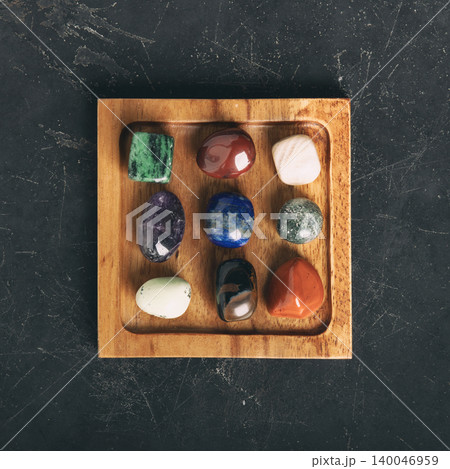 Healing Crystals and Aromatherapy Display on Wooden Tray 140046959