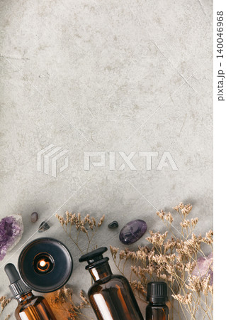 Aromatherapy Essentials with Amber Bottles on Stone Background Aromatherapy Essentials with Amber Bottles on Stone Background 140046968