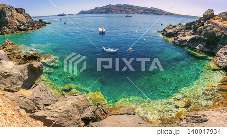 Volcanic cove with crystal clear water in Santorini caldera Greece Volcanic cove with crystal clear water in Santorini caldera Greece 140047934