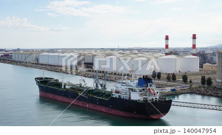 Barcelona, Spain - Aerial view of an container ship docked at a container terminal. Barcelona, Spain - Aerial view of an container ship docked at a container terminal. 140047954