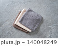 Microfiber cleaning cloths on stone background with copy space 140048249