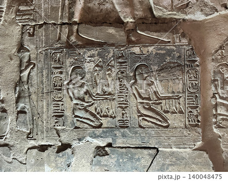 Beautiful bas-reliefs and ancient hieroglyphs in the Temple of Seti I in Abydos, Egypt. 140048475
