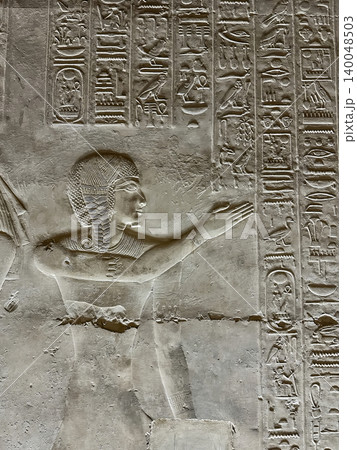 Beautiful bas-reliefs and ancient hieroglyphs in the Temple of Seti I in Abydos, Egypt. 140048503