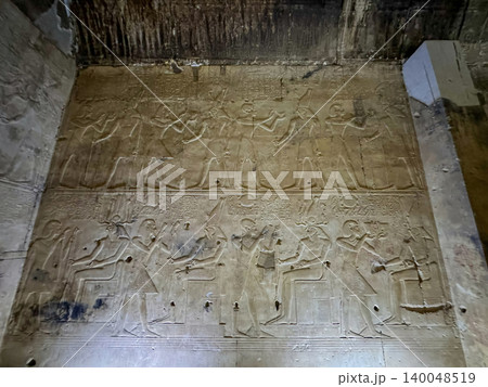 Beautiful bas-reliefs and ancient hieroglyphs in the Temple of Seti I in Abydos, Egypt. 140048519