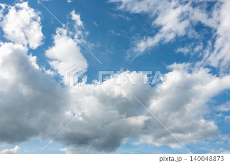 Beautiful sky over the house after a storm with white and dark clouds in the city. Panoramic view of sunset.  140048873