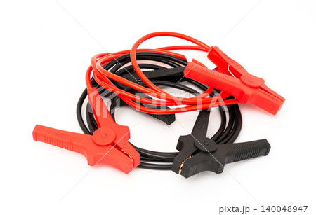 Jumper cables isolated on white background for car battery emergency charging Jumper cables isolated on white background for car battery emergency charging 140048947