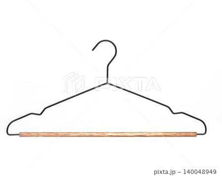 Minimalist black metal clothes hanger with a wooden pants bar, isolated on a white background. Minimalist black metal clothes hanger with a wooden pants bar, isolated on a white background. 140048949