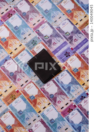 Qatar, Qatari riyal, paper money and coins, financing and commodity exchange, trade. Qatari currency Qatar, Qatari riyal, paper money and coins, financing and commodity exchange, trade. Qatari currency 140049045