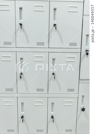 White locker storage cabinets with keys organized secure wall row White locker storage cabinets with keys organized secure wall row 140049357