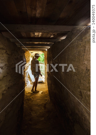 Young woman exploring narrow cave corridor inside Aladzha Monastery Bulgaria Young woman exploring narrow cave corridor inside Aladzha Monastery Bulgaria 140049375