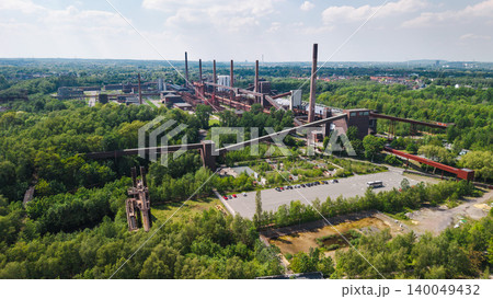 Aerial panorama of historic Zollverein industrial complex in Essen surrounded by green urban landscape in Germany Aerial panorama of historic Zollverein industrial complex in Essen surrounded by green urban landscape in Germany 140049432