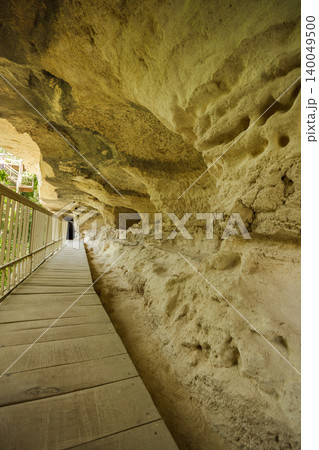 Wooden walkway along cave wall inside Aladzha Monastery Bulgaria Wooden walkway along cave wall inside Aladzha Monastery Bulgaria 140049500