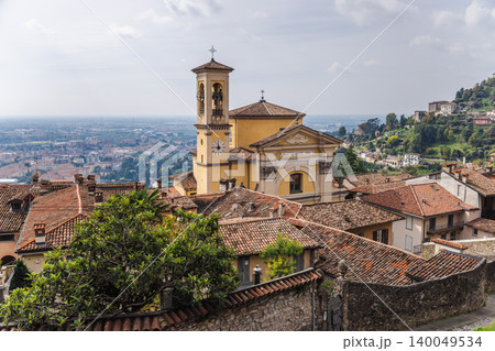 Historic Santa Grata Inter Vites church and rooftops of Bergamo Citta Alta with panoramic city view and Italian landscape 140049534