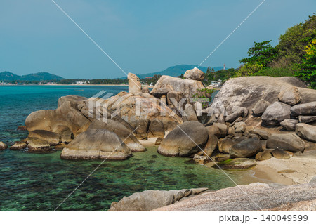 Iconic Hin Ta Grandfather Rock coastal formation on Koh Samui with weathered granite shapes rising above clear turquoise water near Lamai beach Iconic Hin Ta Grandfather Rock coastal formation on Koh Samui with weathered granite shapes rising above clear turquoise water near Lamai beach 140049599