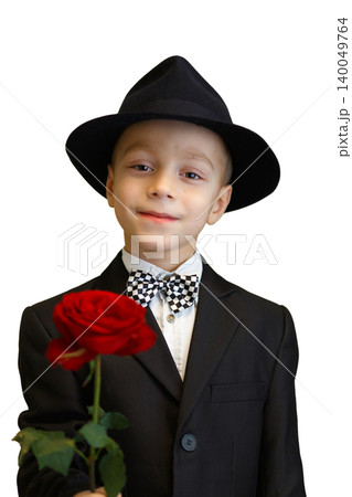 Charming little boy dressed as a gentleman in a suit and hat Charming little boy dressed as a gentleman in a suit and hat 140049764