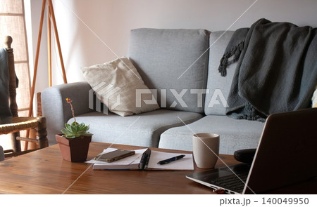 Virtual work items and electronic devices on a livingroom table. Virtual work items and electronic devices on a livingroom table. 140049950
