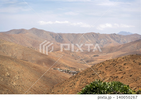 Wide view of Lanzarote desert landscape with volcanic hills and stark island beauty 140050267