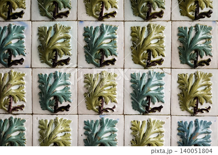 Close up of traditional green leaf patterned azulejo tiles on the wall of Pena Palace in Sintra, Portugal 140051804