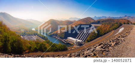 Panorama landscape view around of Srinakarin Dam the power station with large mountains and many trees at Kanchanaburi, Thailand. To generate electricity in the western region of the country Panorama landscape view around of Srinakarin Dam the power station with large mountains and many trees at Kanchanaburi, Thailand. To generate electricity in the western region of the country 140052871