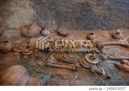 Human skeleton with ancient jewelry or clothing and food containers at the Ban Non civilization site, a temple that is more than 4,000 years old, Non Sung, Nakhon Ratchasima Thailand. Human skeleton with ancient jewelry or clothing and food containers at the Ban Non civilization site, a temple that is more than 4,000 years old, Non Sung, Nakhon Ratchasima Thailand. 140053037