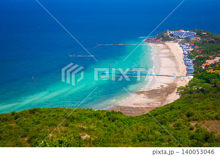Samae Beach, Koh Lan, Chonburi, Thailand: A bird's-eye view reveals a beautiful beach with a turtle-shaped building featuring a solar-powered roof. 140053046