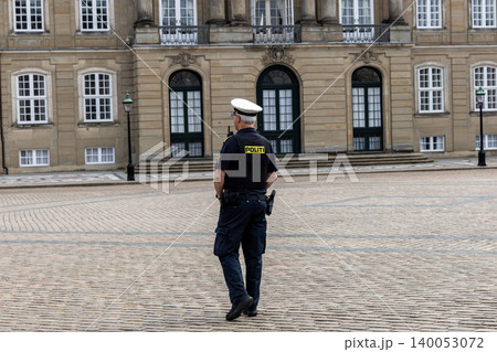 Danish police officer guarding Amalienborg Palace in Copenhagen, Denmark Danish police officer guarding Amalienborg Palace in Copenhagen, Denmark 140053072