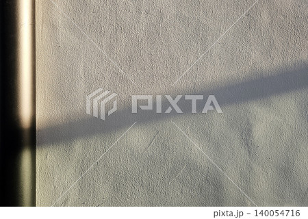 Concrete Wall Background with Sun Rays Creating a Distinct Shadow. Concrete Wall Background with Sun Rays Creating a Distinct Shadow. 140054716