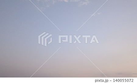 A soft gradient sky photograph, transitioning from a light blue at the top to a faint pinkish-white at the bottom. The sky is mostly clear with a few small, faint clouds. A soft gradient sky photograph, transitioning from a light blue at the top to a faint pinkish-white at the bottom. The sky is mostly clear with a few small, faint clouds. 140055072