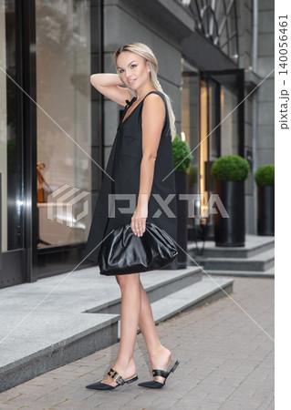Nice blonde wearing a black dress Nice blonde wearing a black dress 140056461