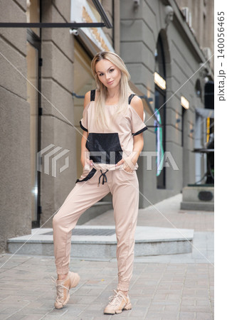 Lovely woman dressed in sports suit Lovely woman dressed in sports suit 140056465