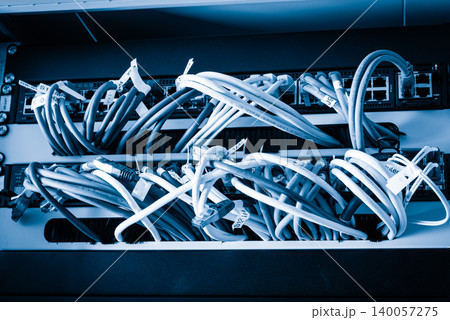 Fiber Optic cables connected to optic ports, network cables conn Fiber Optic cables connected to optic ports, network cables conn 140057275