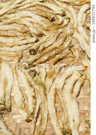 Sun-Dried Chili Peppers on Woven Container Sun-Dried Chili Peppers on Woven Container 140057795