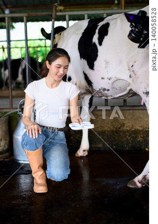 Testing raw milk quality before milking process in dairy farm barn 140058528