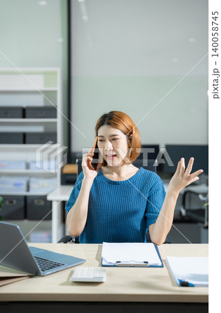 Business woman asian talking phones update plan working on laptop computers, online business. 140058745