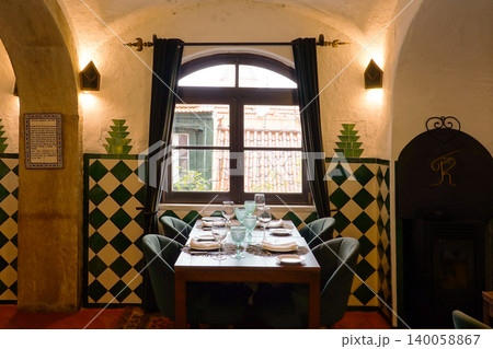 Traditional restaurant interior with green checkered azulejo tiles and set table in Sintra, Portugal 140058867