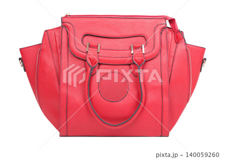 Bright red leather handbag with side wings and zippers isolated on white background. Front view of a large modern female tote bag, fashion accessory. Bright red leather handbag with side wings and zippers isolated on white background. Front view of a large modern female tote bag, fashion accessory. 140059260